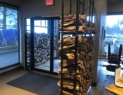 Firewood display stacks at shop entry